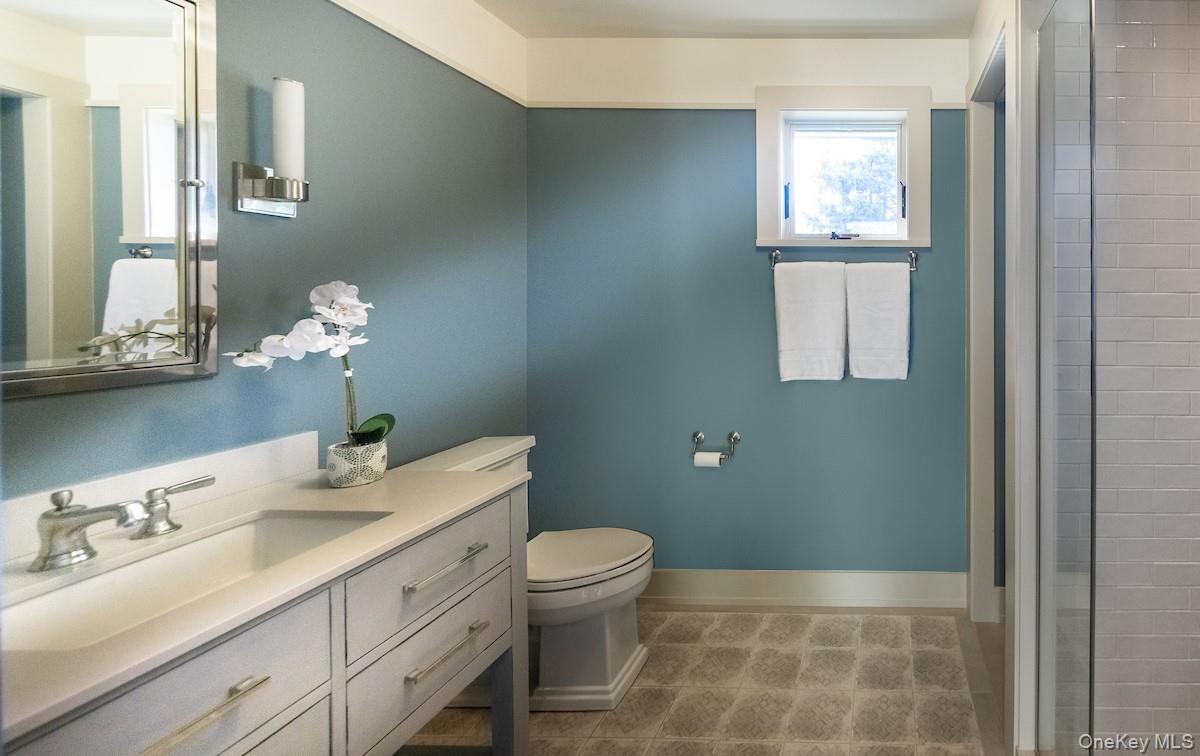 10 Sherman Avenue Dobbs Ferry, NY 10522 - Photo 22 of 36 a bathroom with a sink a toilet and a mirror