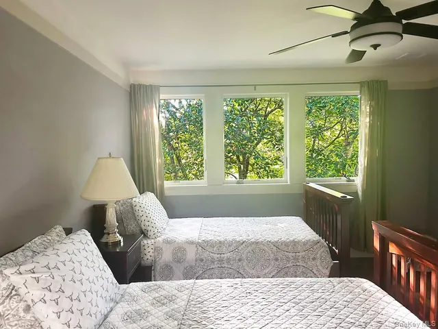 a bed room with a bed and a window