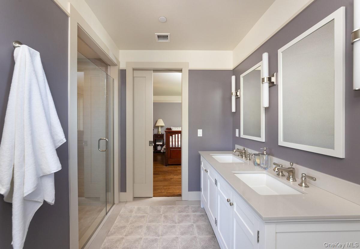 10 Sherman Avenue Dobbs Ferry, NY 10522 - Photo 26 of 36 a bathroom with a double vanity sink and a mirror
