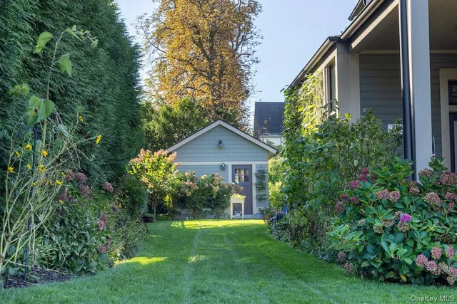 a view of backyard with garden and plants