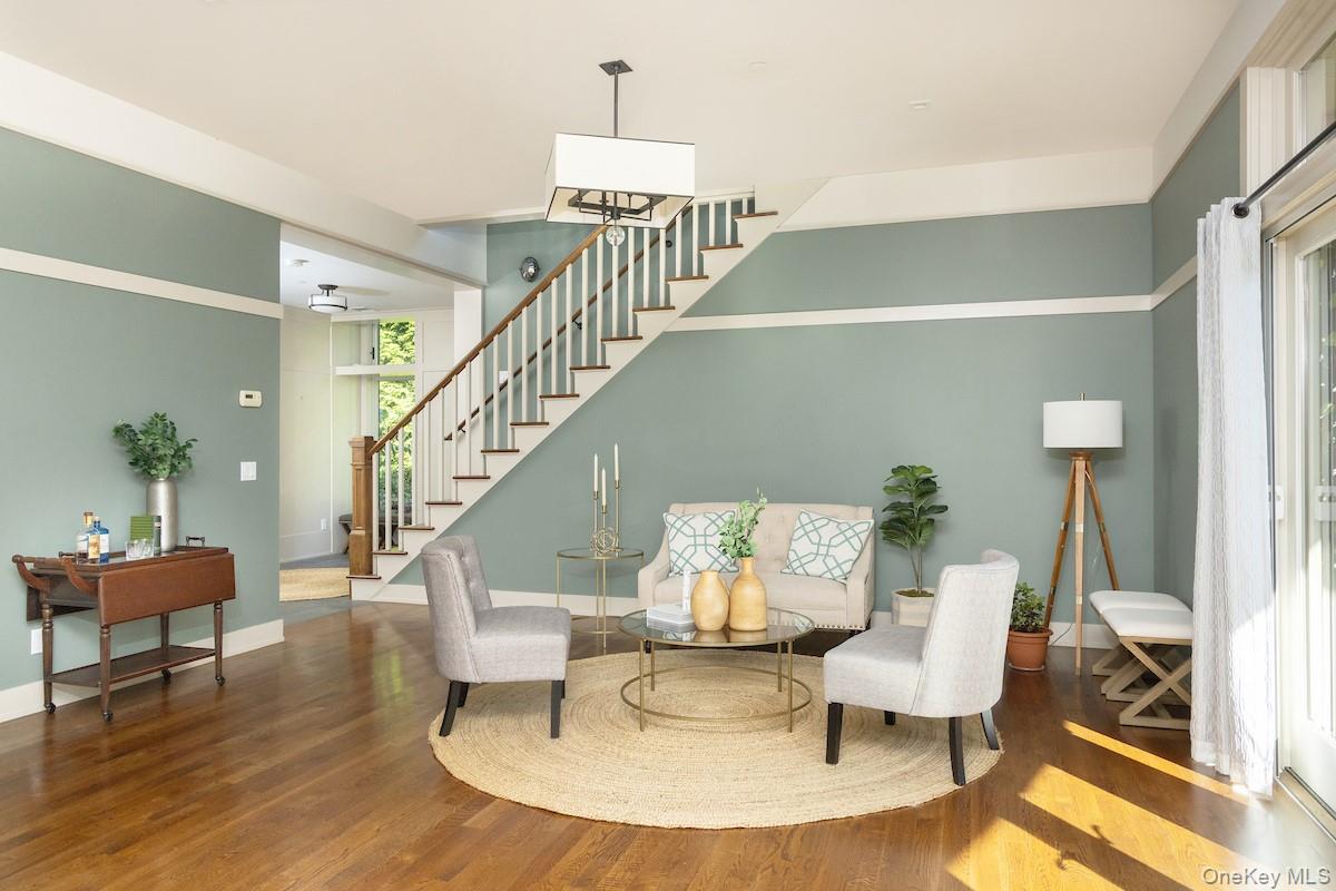 10 Sherman Avenue Dobbs Ferry, NY 10522 - Photo 5 of 36 a living room with furniture and a dining table with wooden floor
