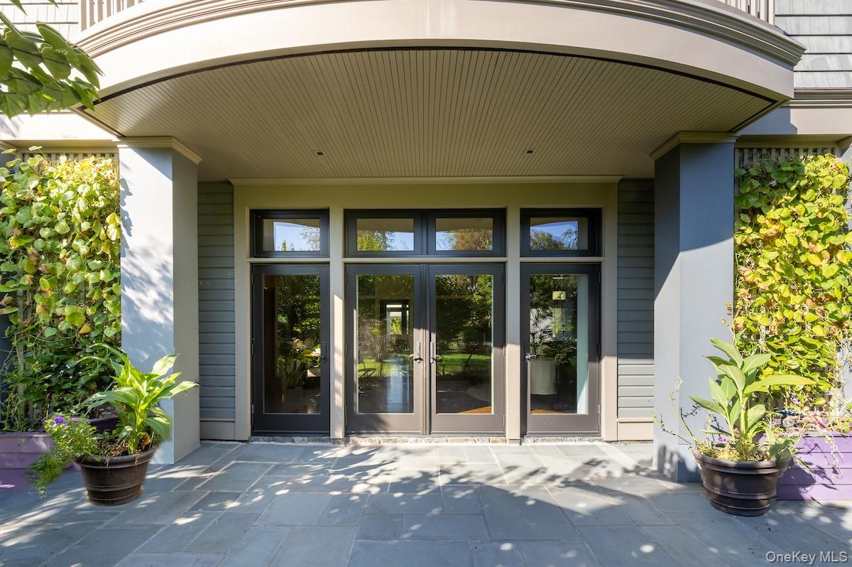 10 Sherman Avenue Dobbs Ferry, NY 10522 - Photo 8 of 36 a house with a potted plant in front of it