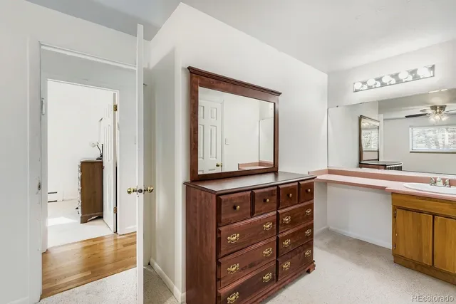 a room with a dresser and a mirror