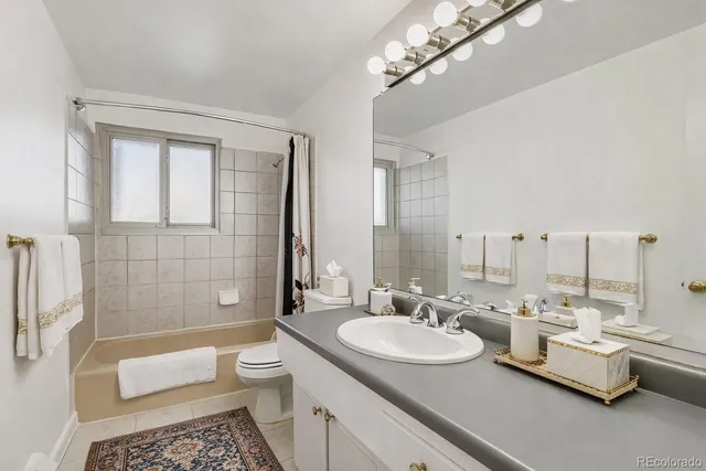 a bathroom with a sink double vanity and a mirror