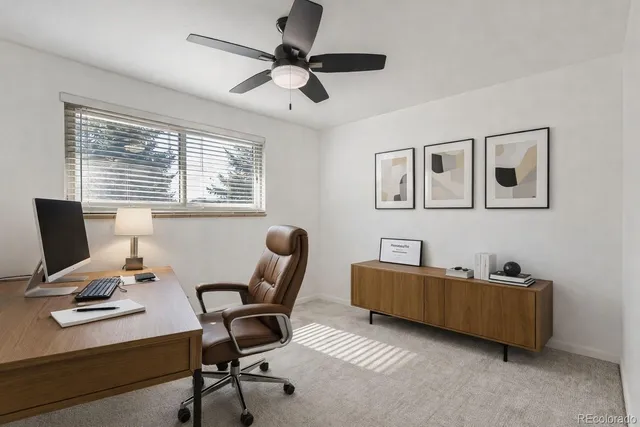 a work room with furniture and windows