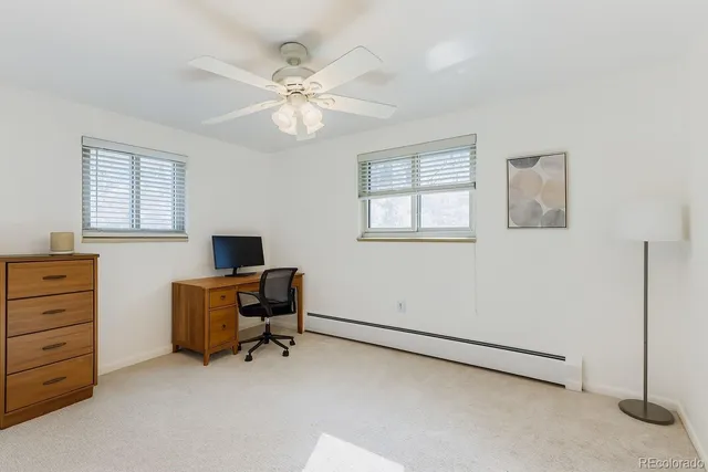 a view of workspace with wooden floor and windows