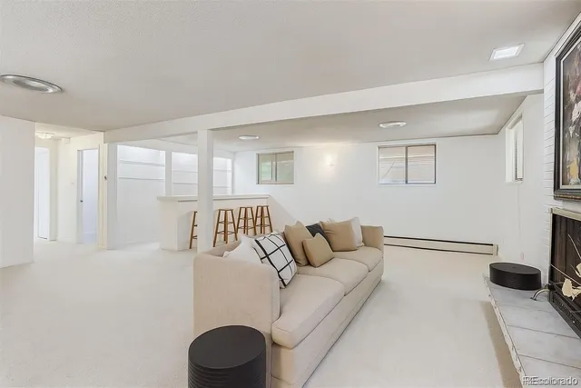 a bedroom with a bed and a couch