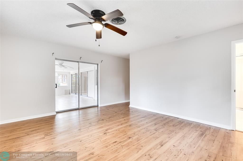 3460 Northeast 28th Avenue Lighthouse Point, FL 33064 - Photo 13 of 37 a view of an empty room with wooden floor