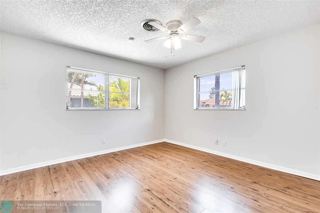 3460 Northeast 28th Avenue Lighthouse Point, FL 33064 - Photo 25 of 37 a view of empty room with wooden floor and fan