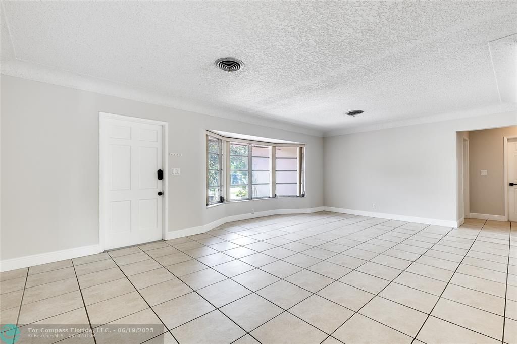 3460 Northeast 28th Avenue Lighthouse Point, FL 33064 - Photo 3 of 37 a view of an empty room and window