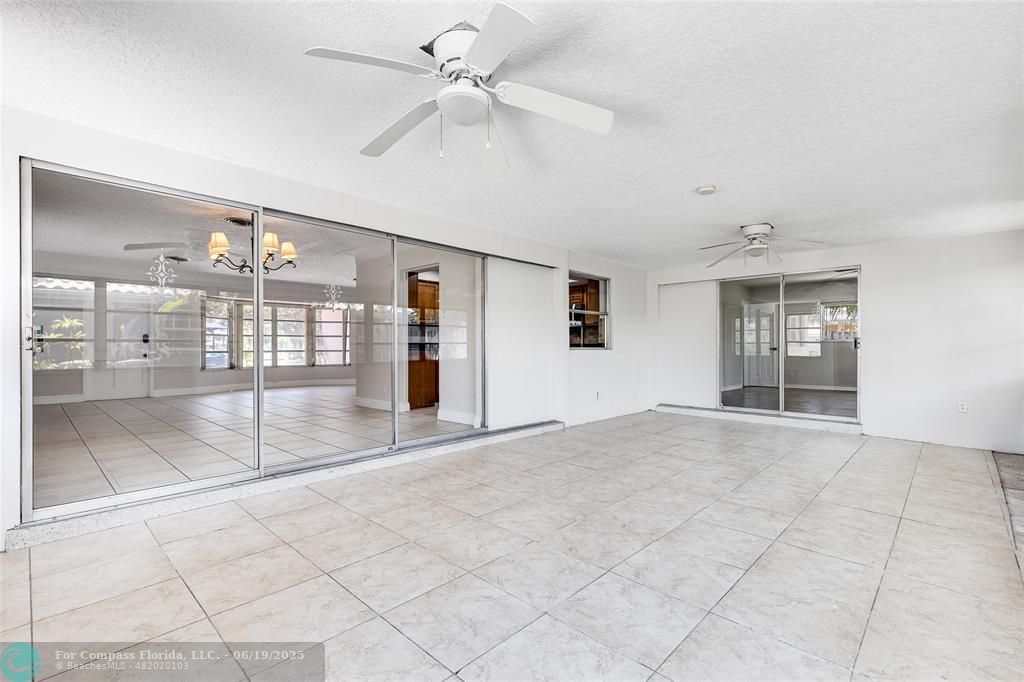 3460 Northeast 28th Avenue Lighthouse Point, FL 33064 - Photo 31 of 37 a view of an empty room with window and a kitchen