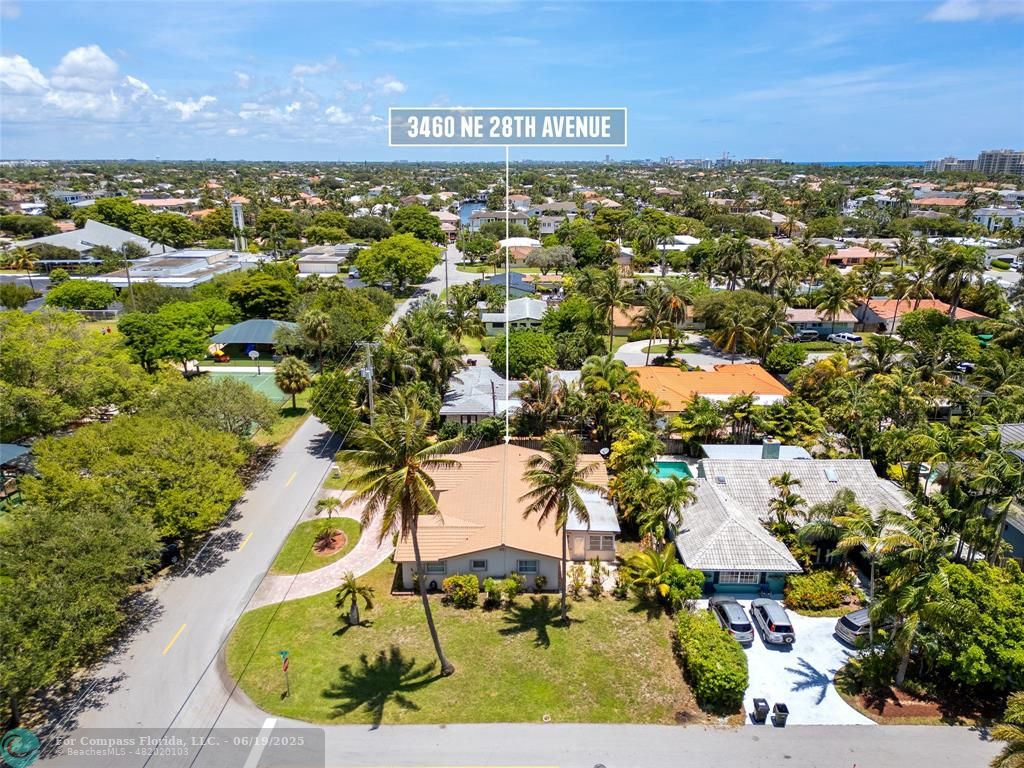 3460 Northeast 28th Avenue Lighthouse Point, FL 33064 - Photo 34 of 37 an aerial view of residential houses with outdoor space and trees
