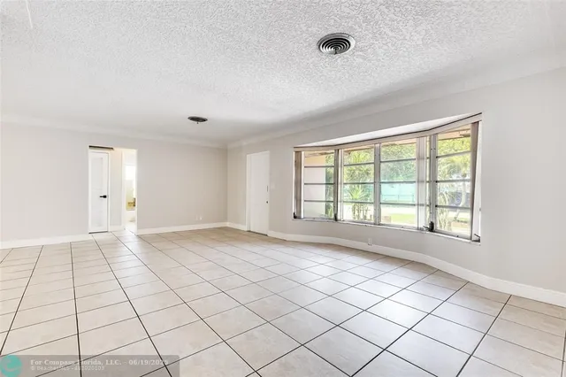 a view of an empty room and window