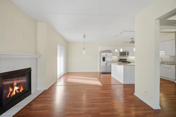 a view of kitchen and hall with wooden floor
