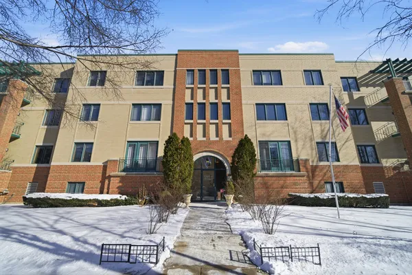 a front view of a building with many windows