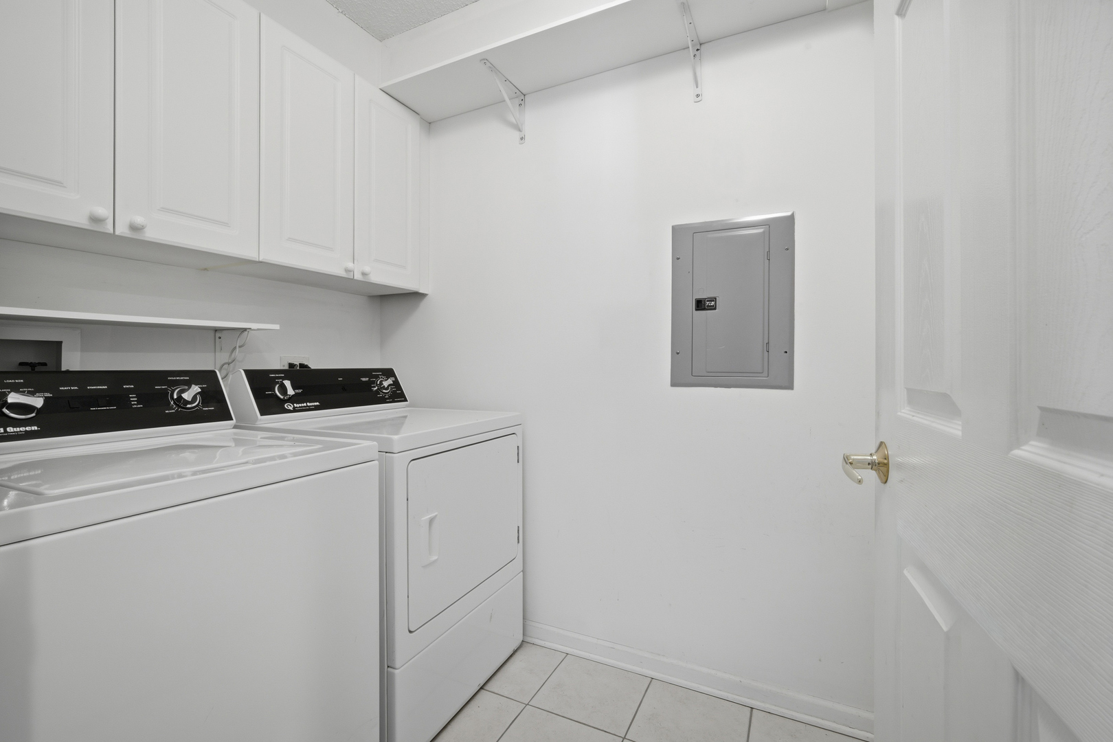 115 North Clifton Avenue, Unit 103 Park Ridge, IL 60068 - Photo 23 of 27 a kitchen with white cabinets and white appliances