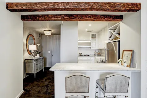 a bathroom with a sink a washer and dryer