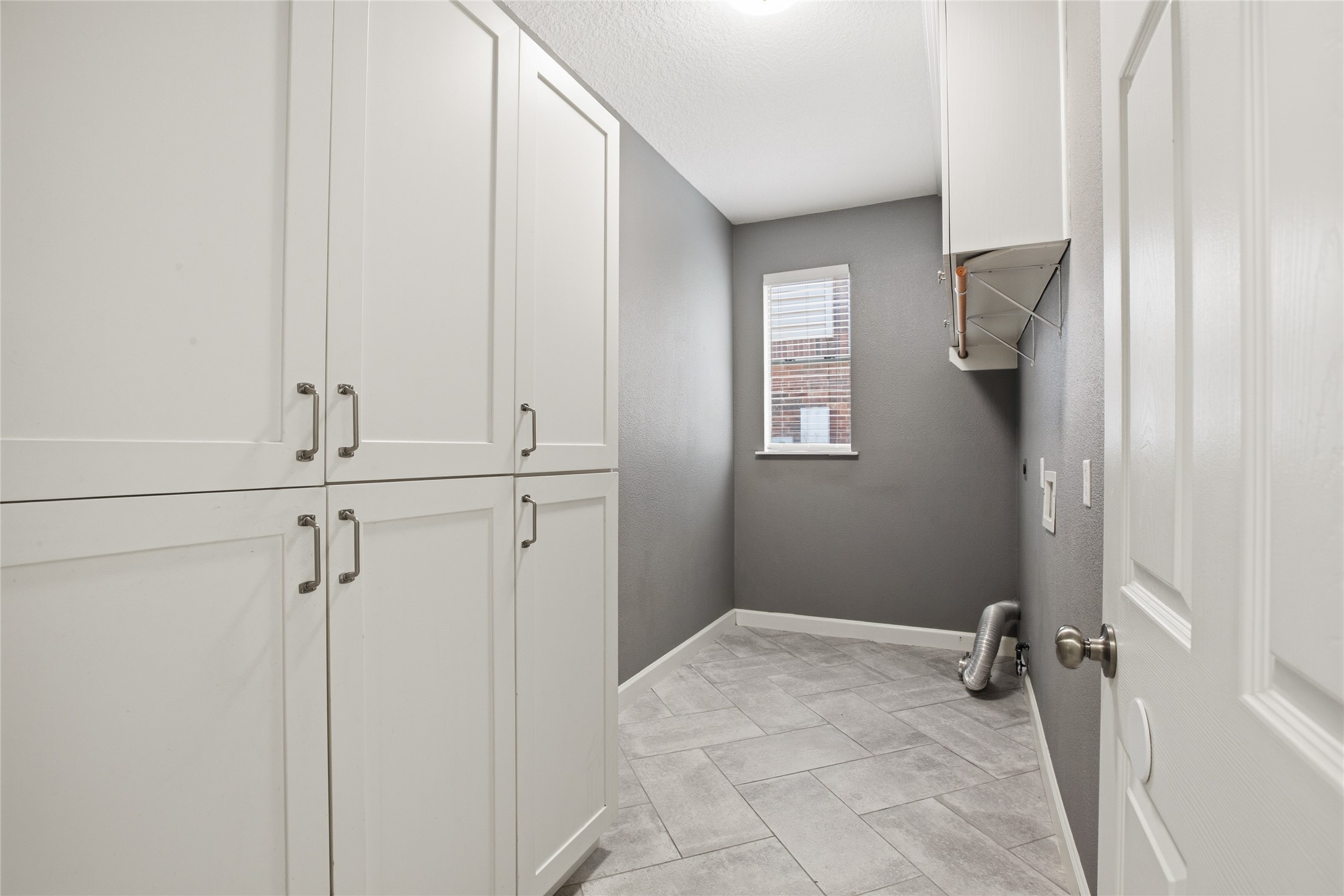 20907 Nettlebrook Lane Katy, TX 77450 - Photo 19 of 46 The utility room handles the behind-the-scenes with ease. Cabinets keep everything organized, leaving less clutter in your day-to-day.