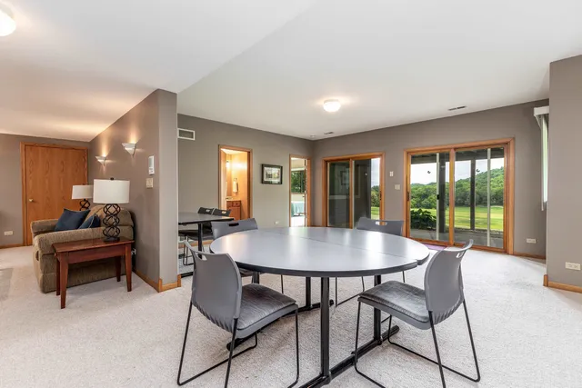 a view of a dining room with furniture window and outside view