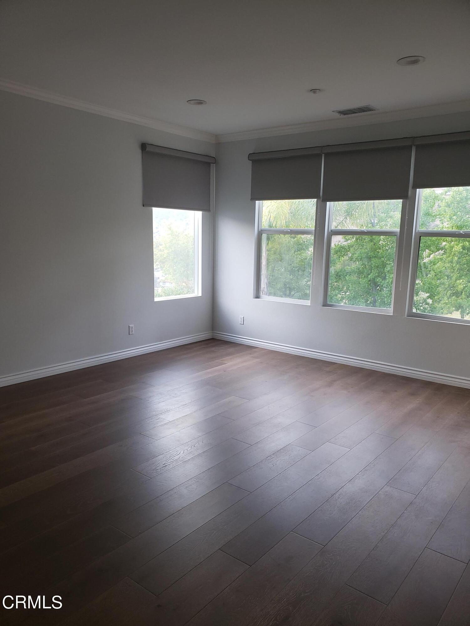 7454 Chanteclair Court Tujunga, CA 91042 - Photo 12 of 25 a view of room with window and wooden floor