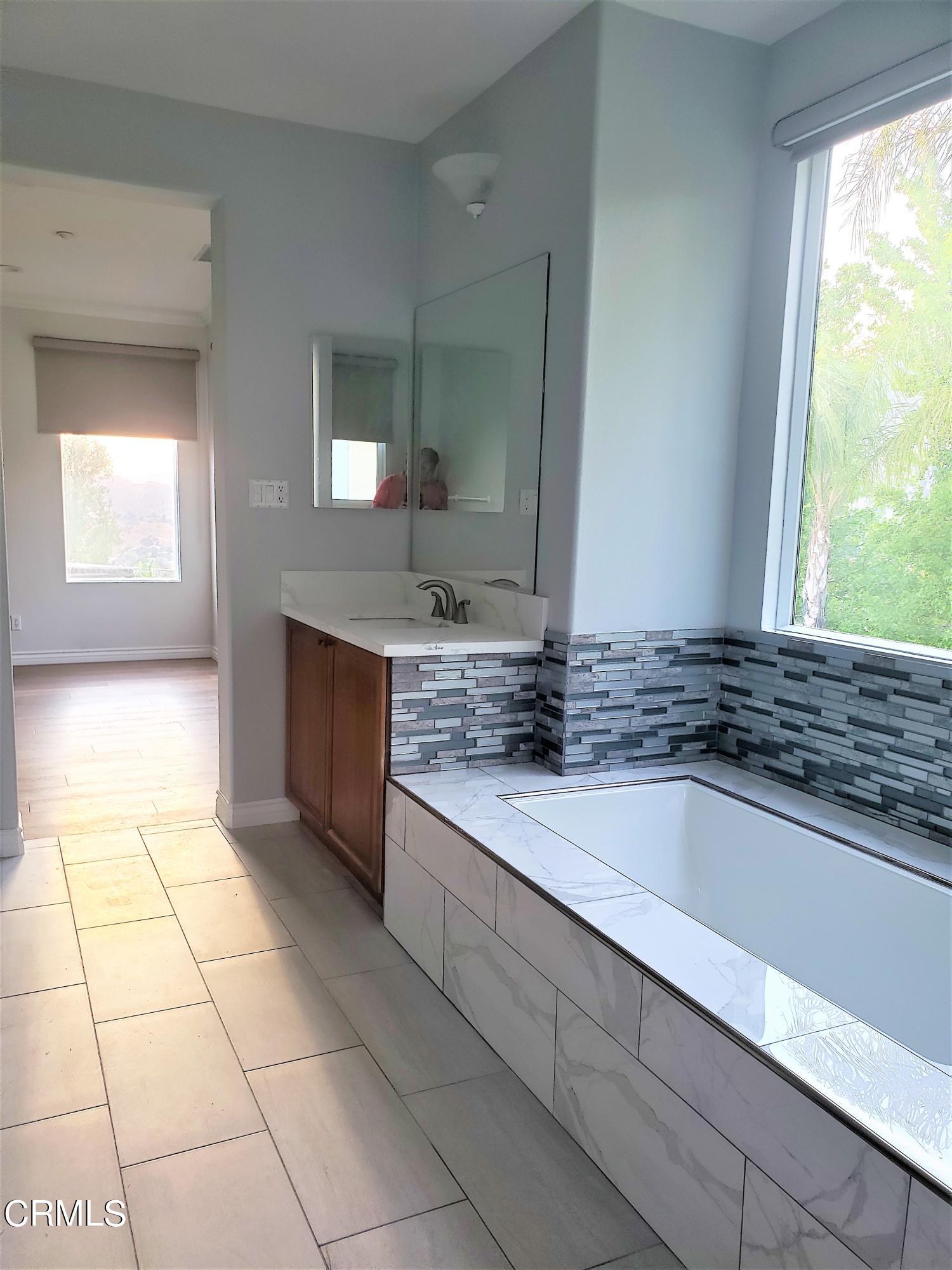 7454 Chanteclair Court Tujunga, CA 91042 - Photo 13 of 25 a kitchen with a sink a counter top space and cabinets