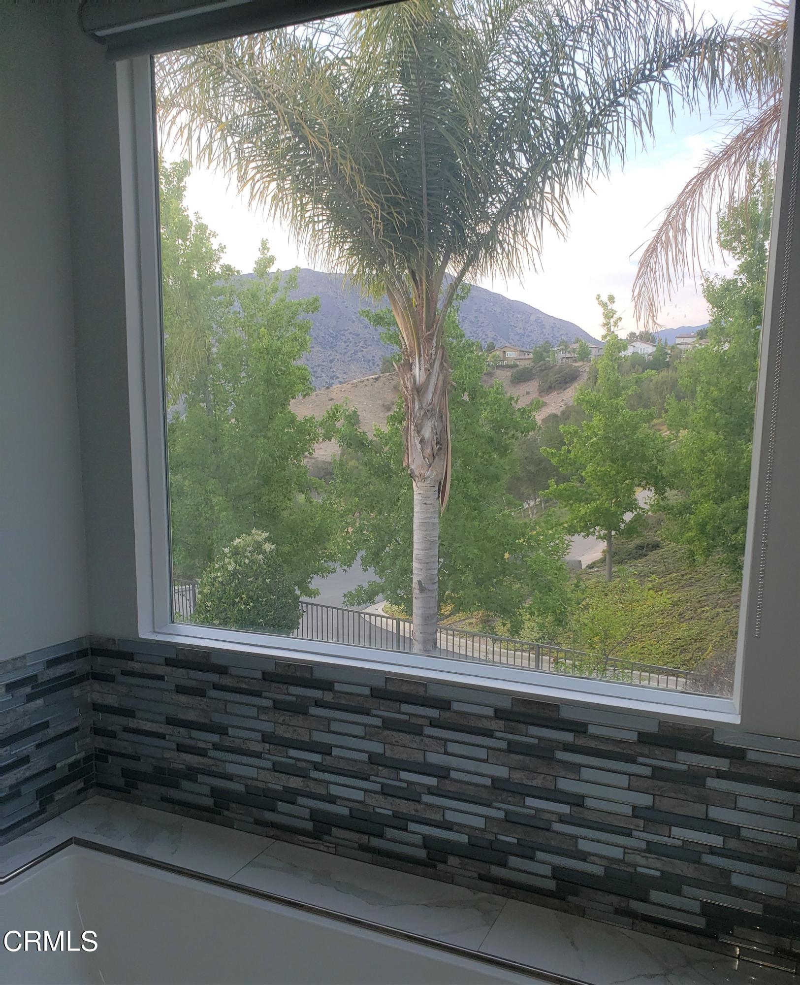 7454 Chanteclair Court Tujunga, CA 91042 - Photo 14 of 25 a view of a glass door and a window