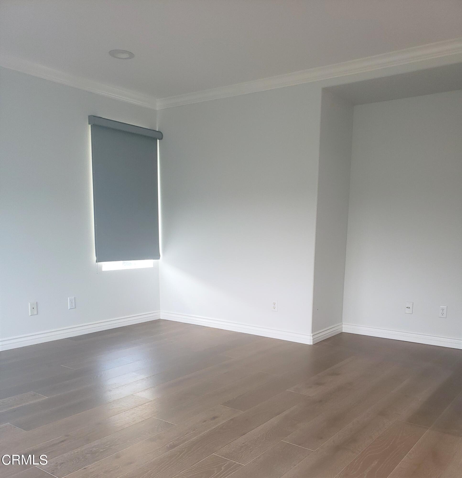 7454 Chanteclair Court Tujunga, CA 91042 - Photo 25 of 25 a view of empty room with wooden floor and fan