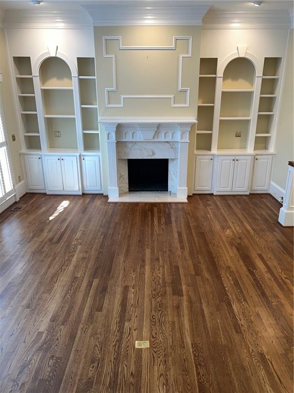 3184 Andrews Court Northwest Atlanta, GA 30305 - Photo 11 of 60 an empty room with wooden floor fireplace and windows