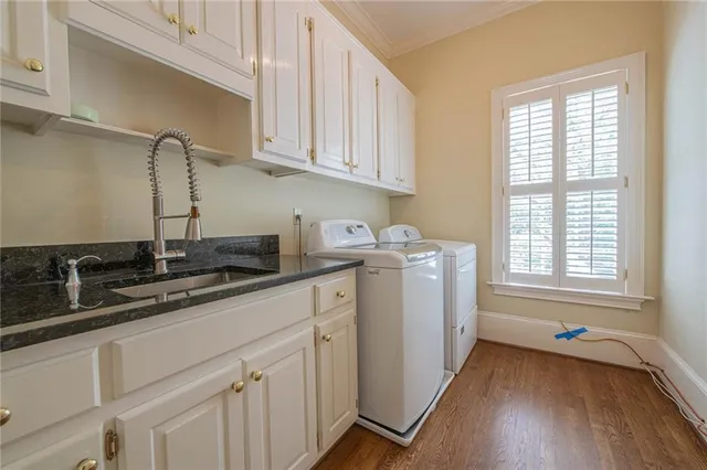 a kitchen with sink cabinets and window