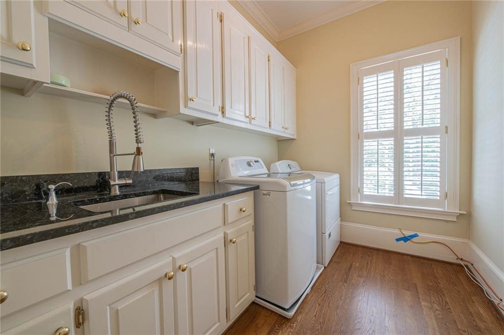 3184 Andrews Court Northwest Atlanta, GA 30305 - Photo 18 of 60 a kitchen with sink cabinets and window