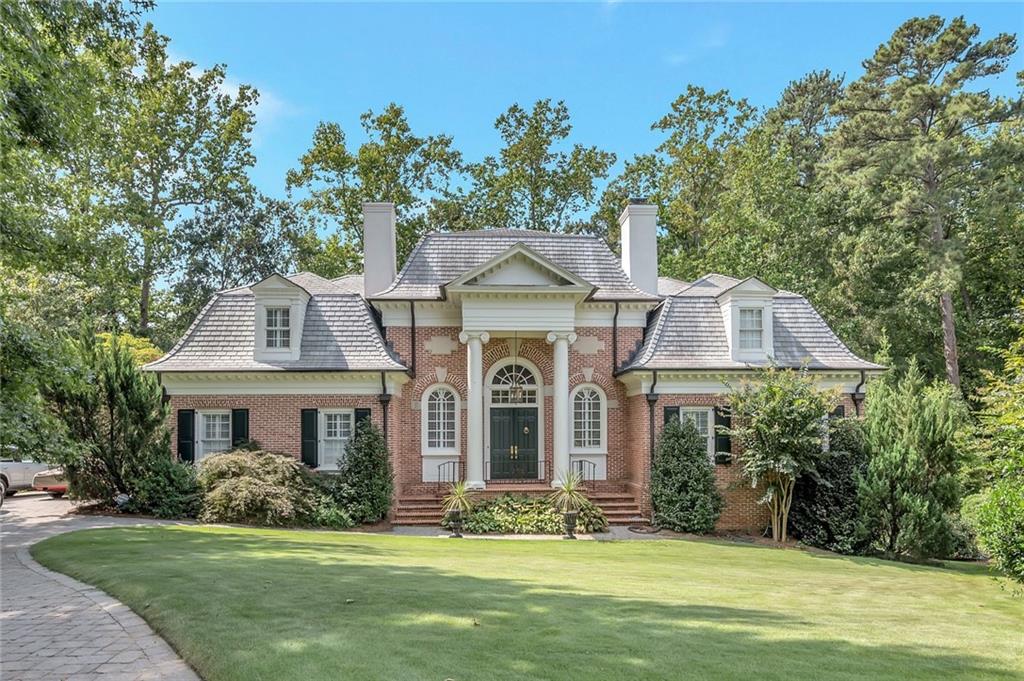 3184 Andrews Court Northwest Atlanta, GA 30305 - Photo 2 of 60 a front view of a house with a garden