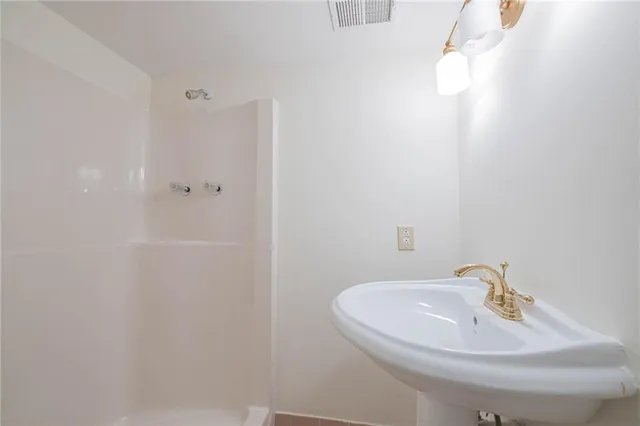 a view of roof deck with wooden floor and seating space
