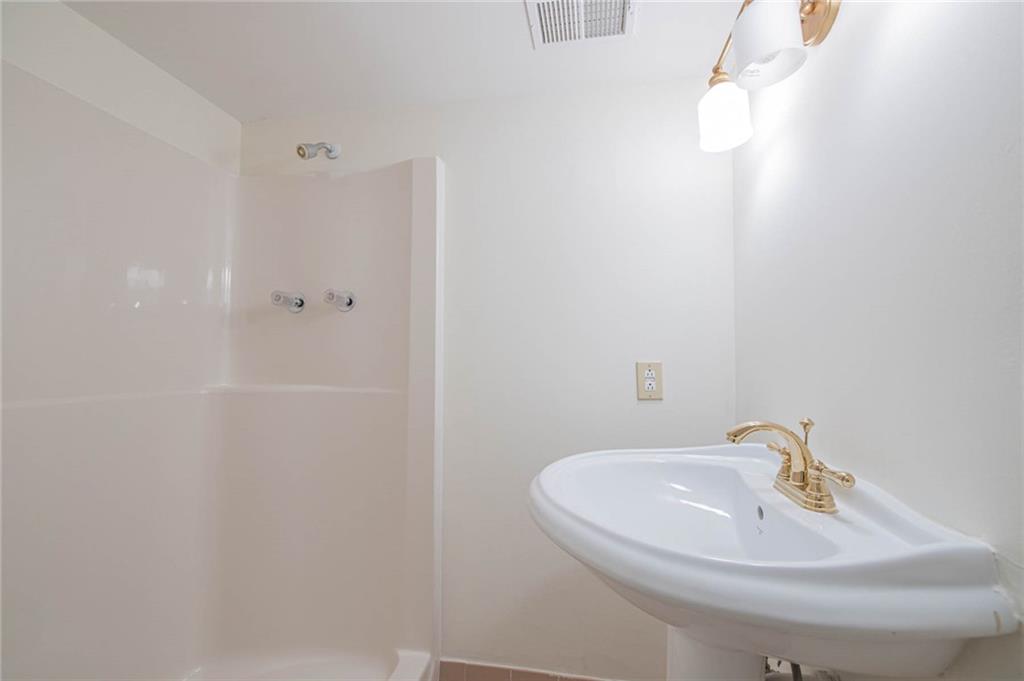 3184 Andrews Court Northwest Atlanta, GA 30305 - Photo 47 of 60 a bathroom with a sink and a mirror