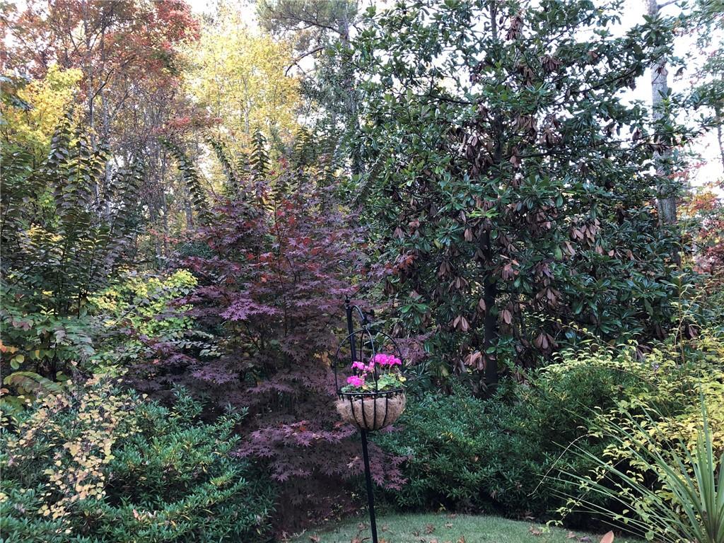 3184 Andrews Court Northwest Atlanta, GA 30305 - Photo 57 of 60 a front view of a house with a yard and fountain in middle