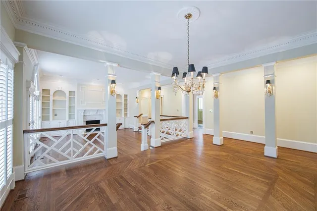 a view of a livingroom with furniture and floor to ceiling window