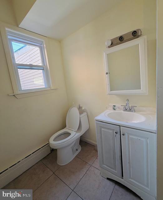 231 3rd Street Gloucester City, NJ 08030 - Photo 15 of 23 a bathroom with a toilet sink and mirror