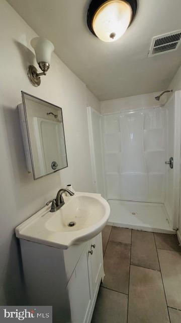 231 3rd Street Gloucester City, NJ 08030 - Photo 16 of 23 a bathroom with a sink a toilet and a mirror