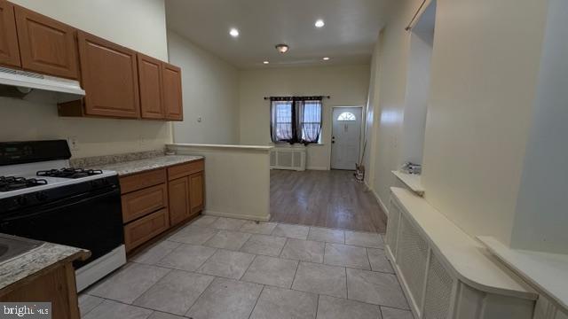 231 3rd Street Gloucester City, NJ 08030 - Photo 2 of 23 a kitchen with stainless steel appliances granite countertop a sink stove and cabinets