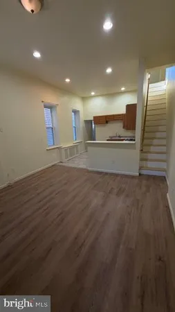 a view of kitchen and wooden floor