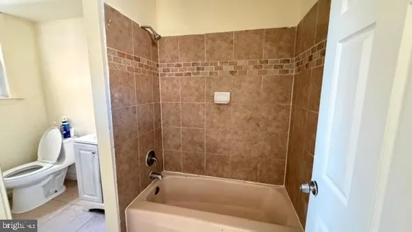 a bathroom with a shower and a toilet