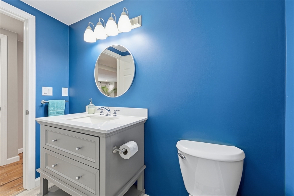 160 Cottage Street Athol, MA 01331 - Photo 13 of 35 a bathroom with a toilet sink vanity and mirror