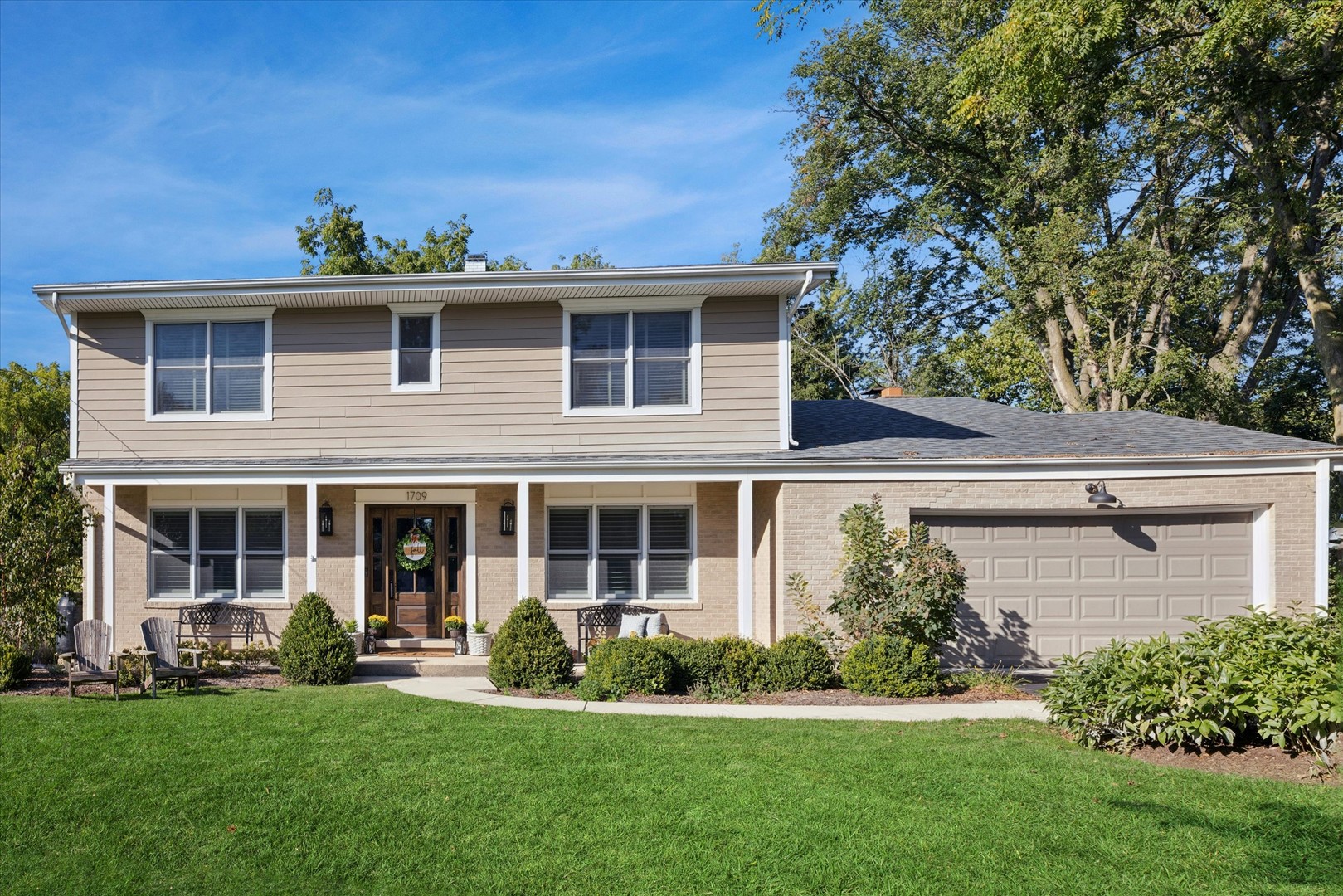 front view of a house with a yard