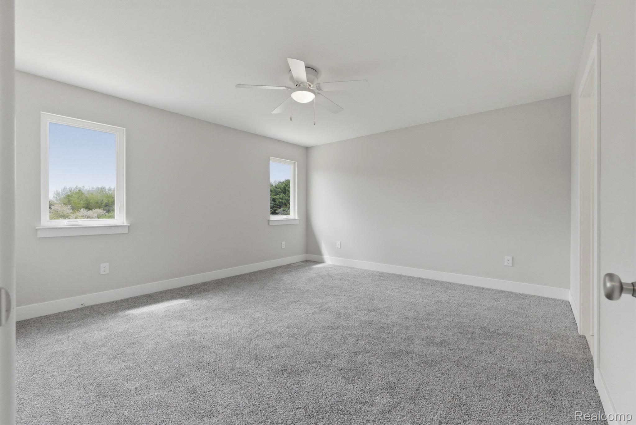 2361 Baltimore Davison, MI 48423 - Photo 10 of 31 Unfurnished room featuring light colored carpet and a ceiling fan