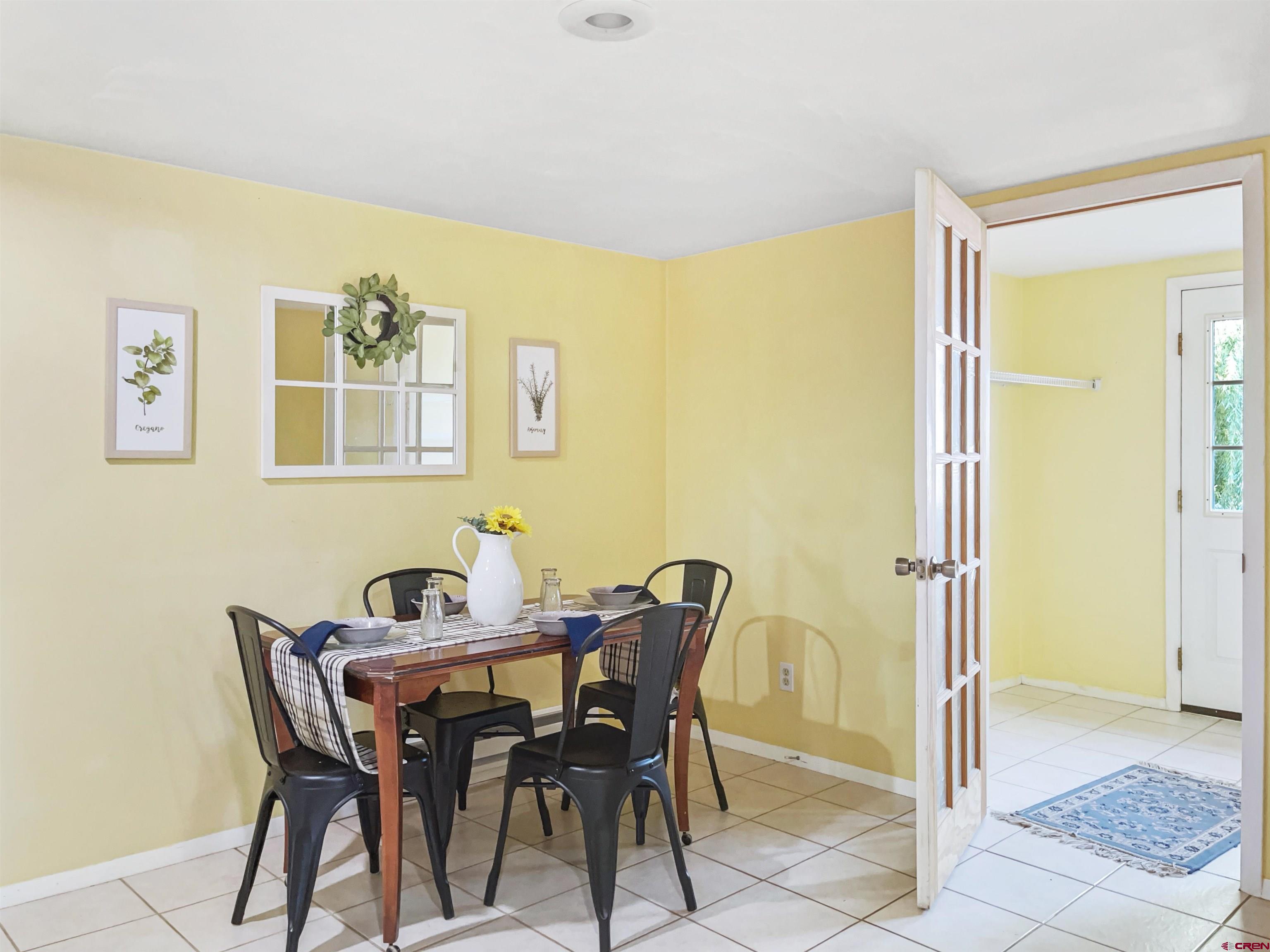 22779 Rd L Cortez, CO 81321 - Photo 11 of 30 a view of a dining room with furniture and a window