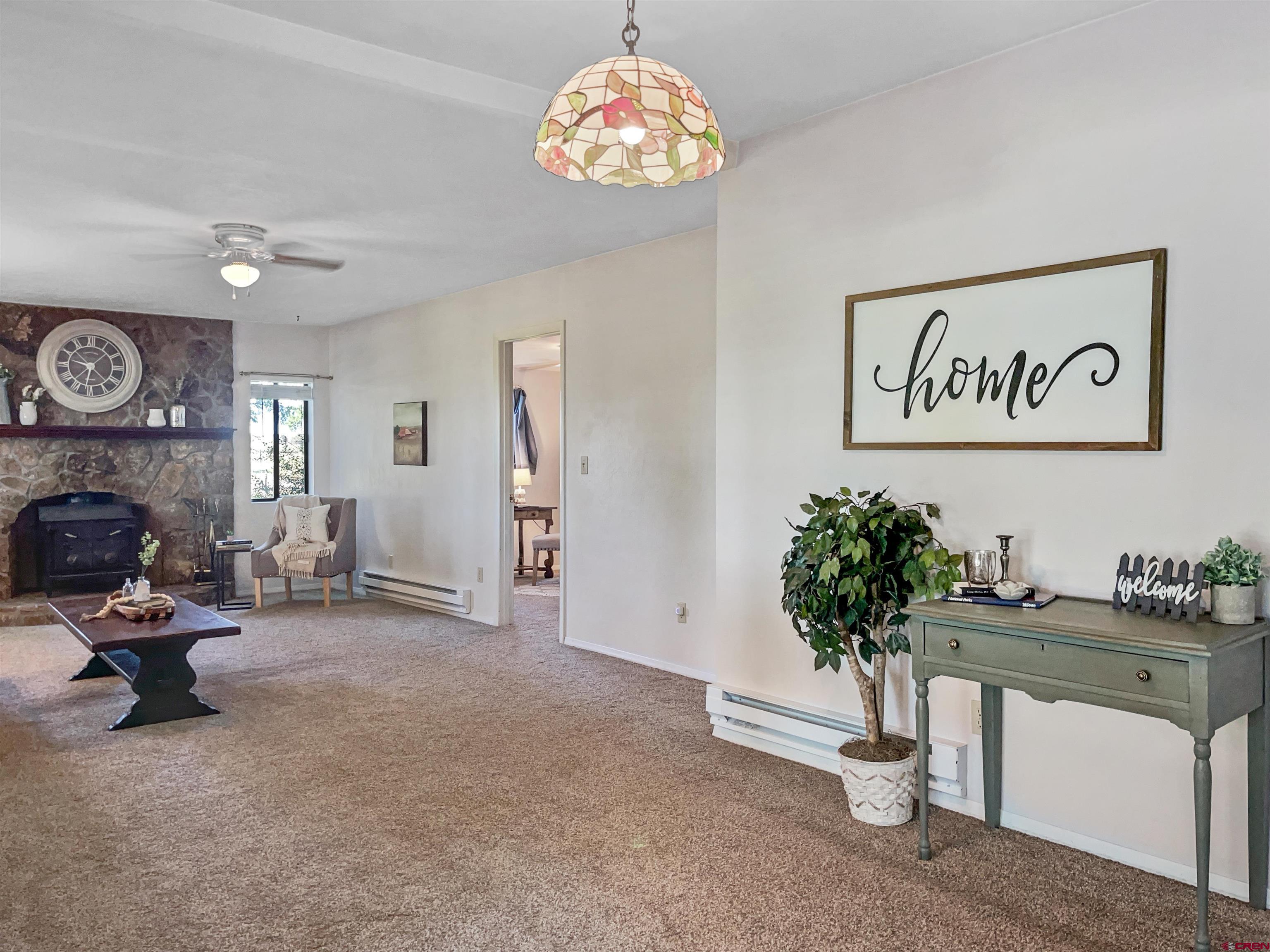 22779 Rd L Cortez, CO 81321 - Photo 3 of 30 a view of a livingroom with furniture and a chandelier