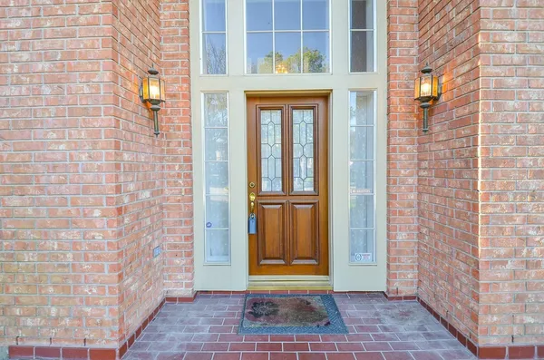 a view of a brick house with a door
