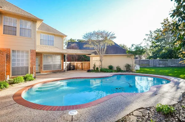 a view of a house with swimming pool