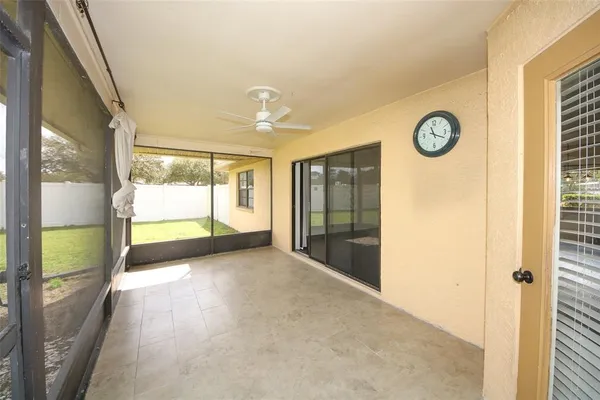 a view of a glass door with a yard