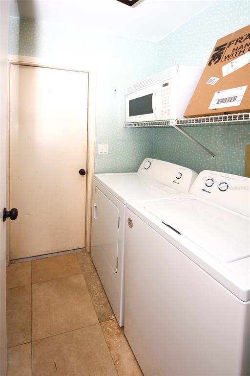 9297 Pickens Street Spring Hill, FL 34608 - Photo 27 of 40 a utility room with dryer and washer