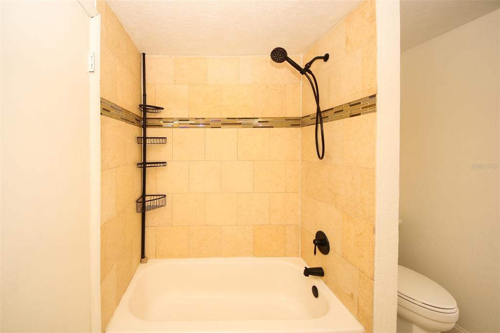 9297 Pickens Street Spring Hill, FL 34608 - Photo 29 of 40 a bathroom with a shower